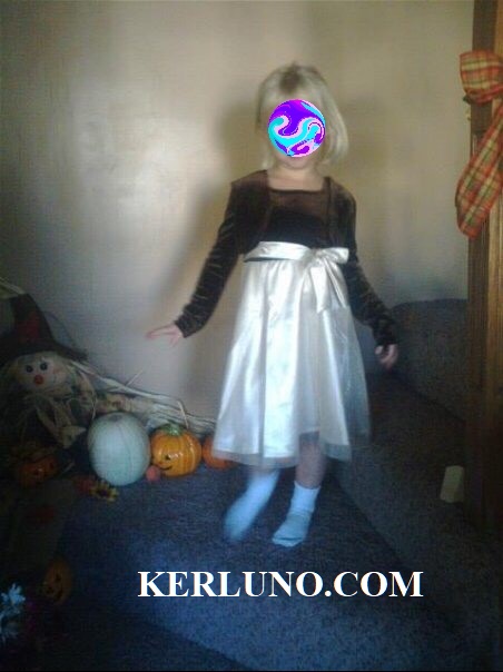 Little girl on stairs, with ghostly face next to her.